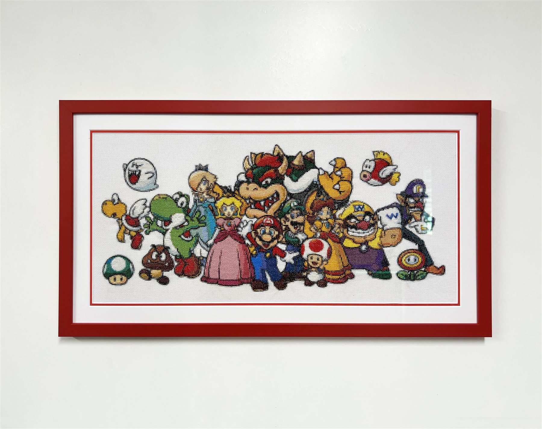 Framed Mario cross-stitch needlework